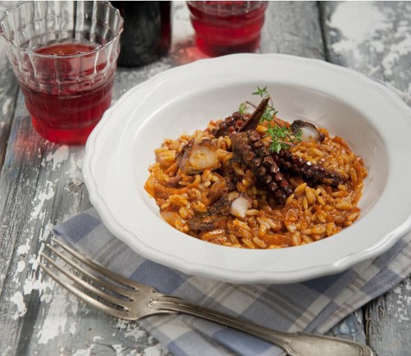 Octopus with aromatic herbs and barley-shaped pasta
